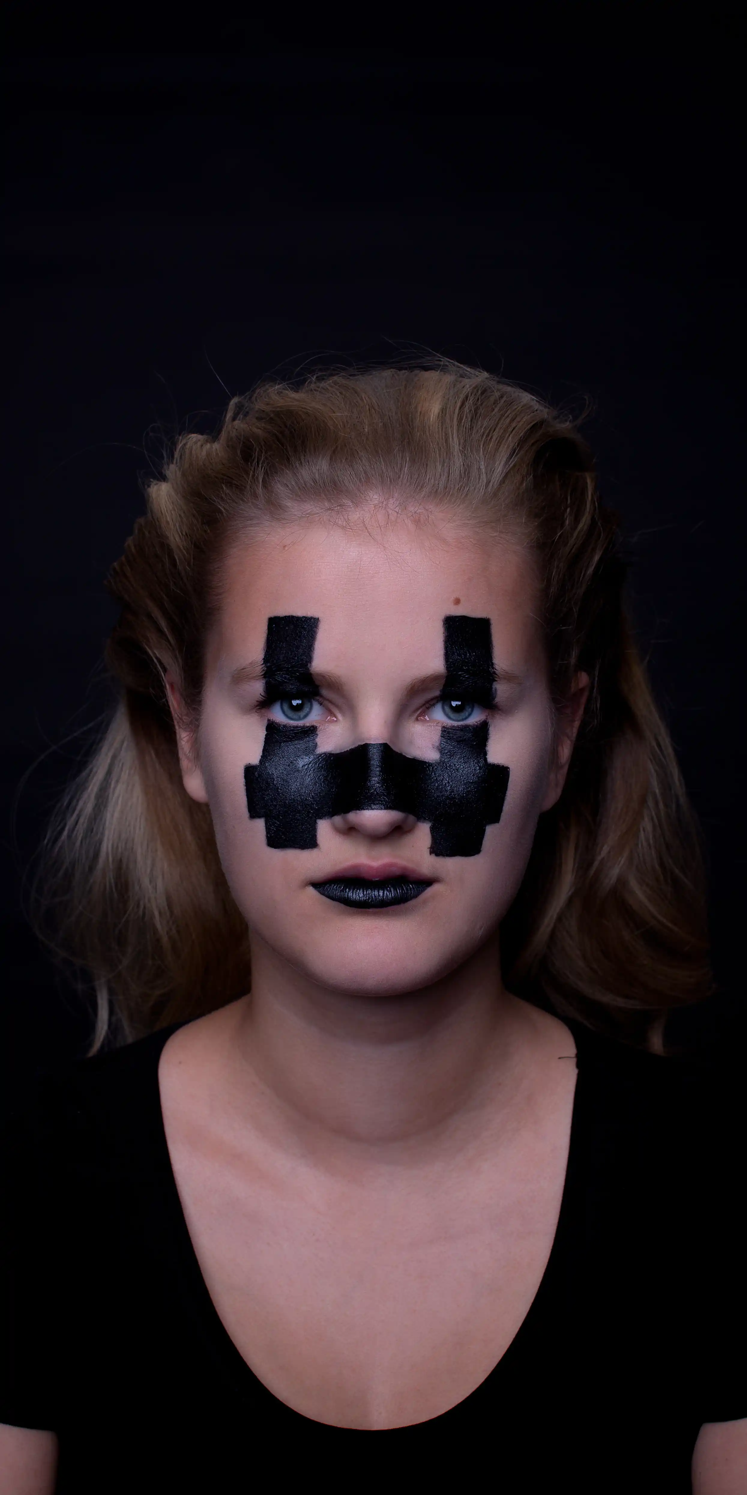 A model with blocky facepaint